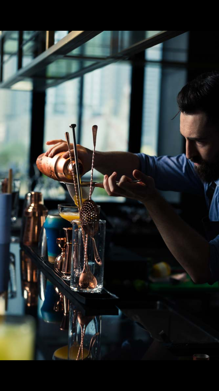 Brandon Grusd making a cocktail